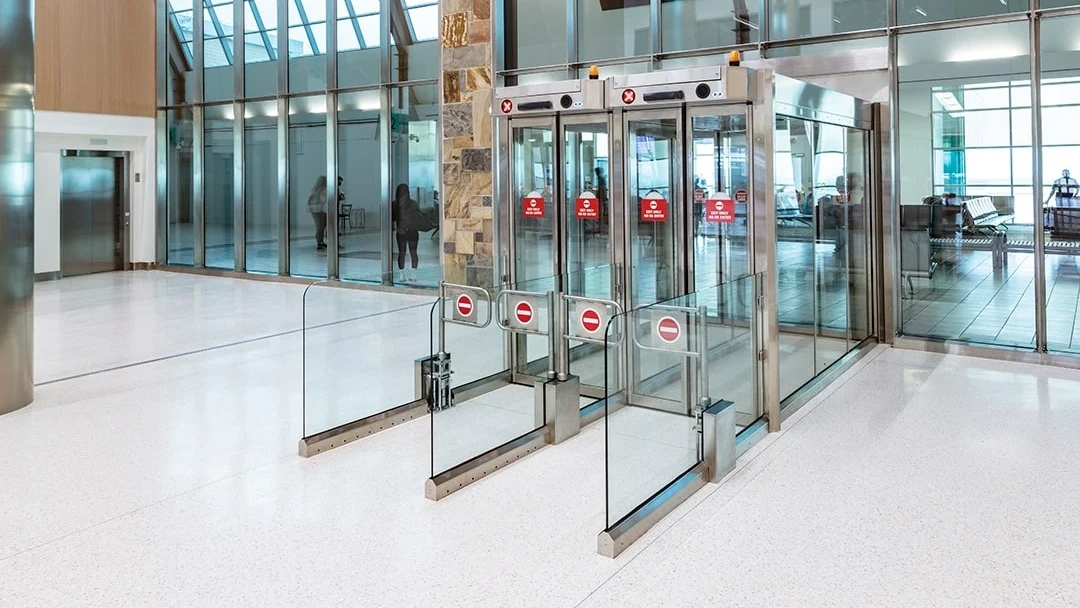 View of the security doors next to the curtain wall leading into the terminal area.
